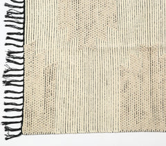 Tufted & Tasseled Neutral rug