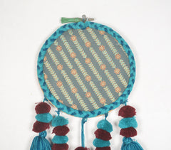 Embroidery hoop Teal tasseled wall hanging